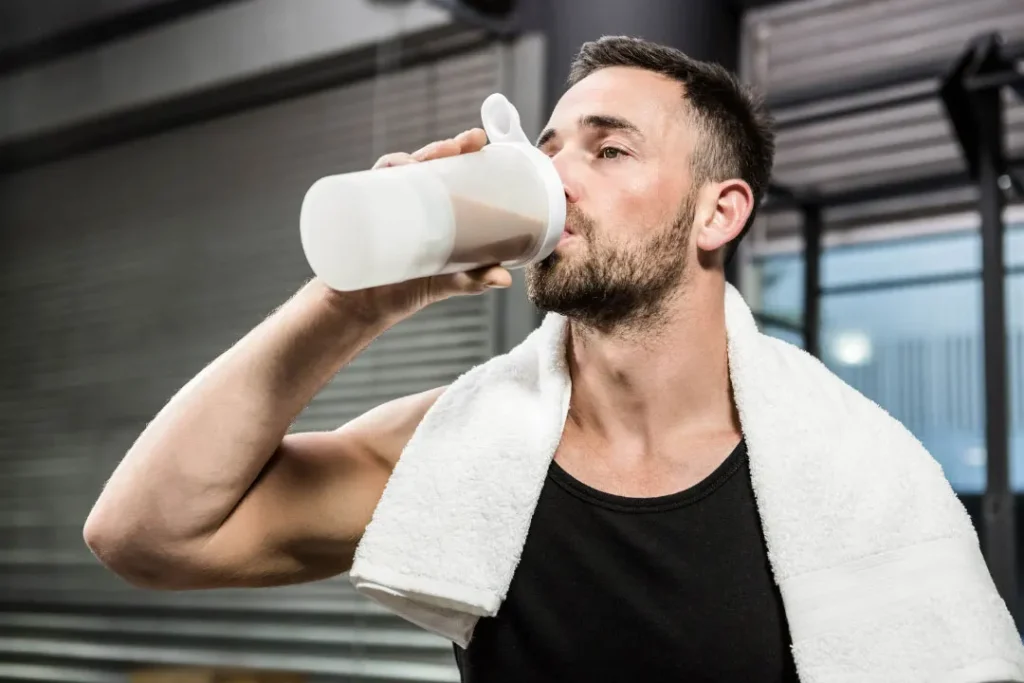 A man enjoying the protein powder shake.